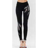 Leggings con estampado de plumas vocales